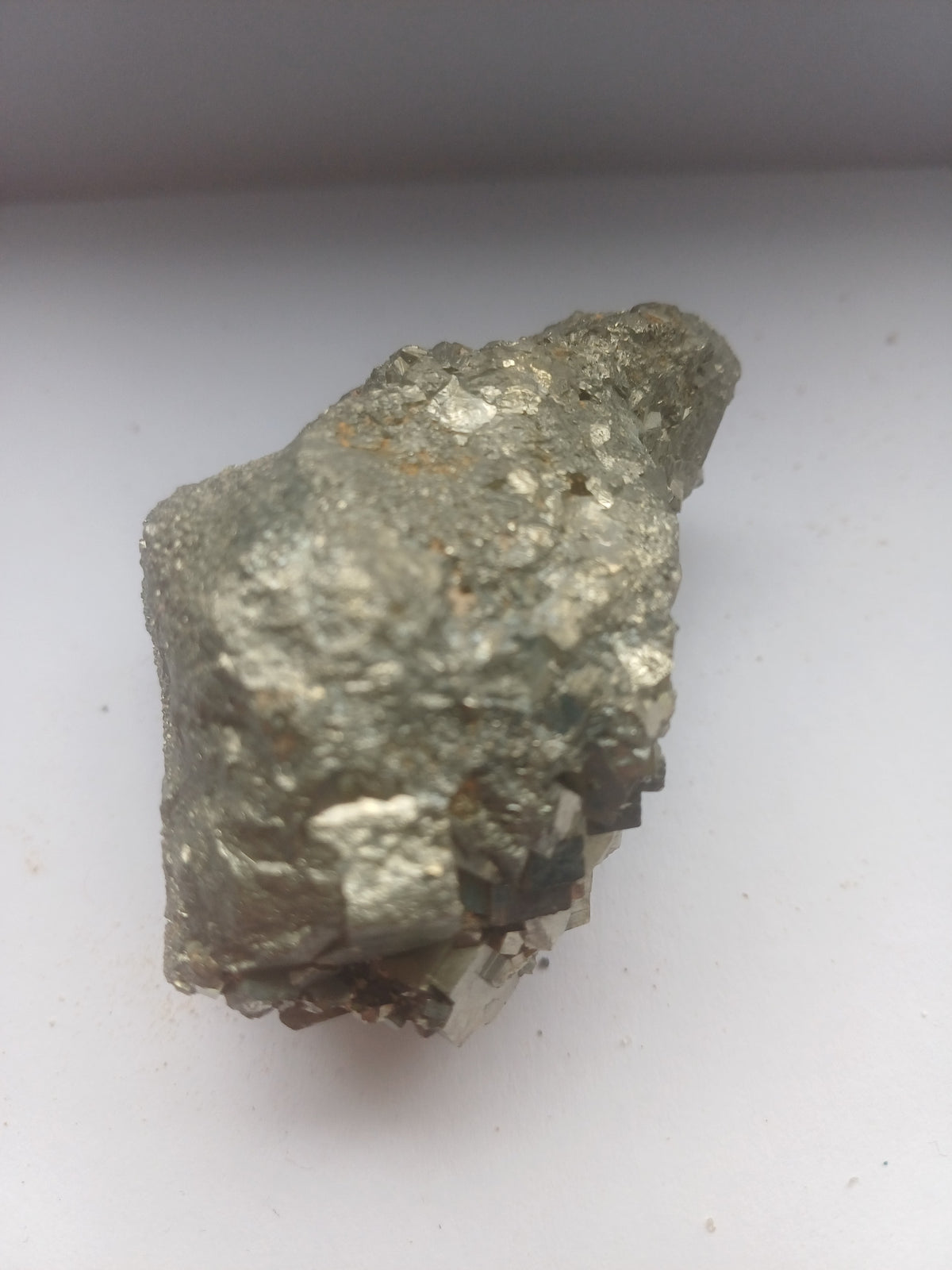 Reverse side of natural pyrite cluster showing metallic matrix and crystal growth