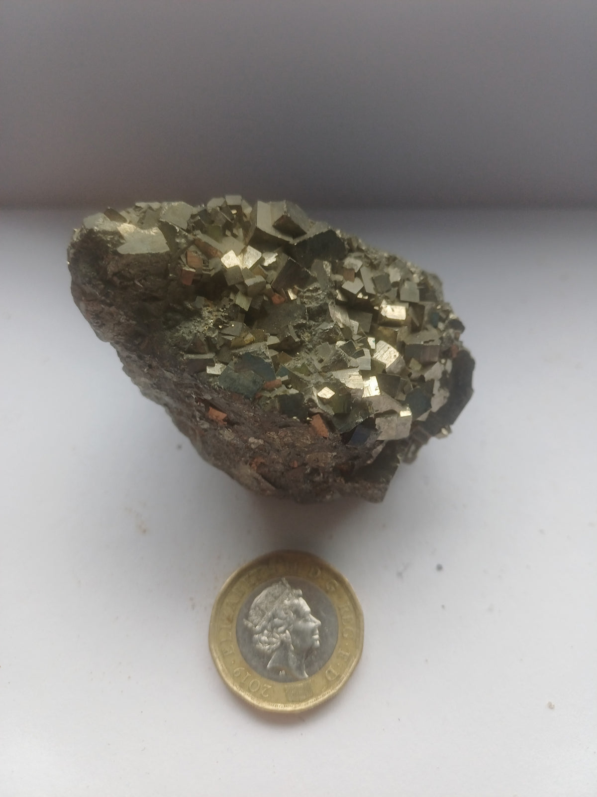 One-of-a-kind natural pyrite cluster around 60mm with dense metallic cubic crystals