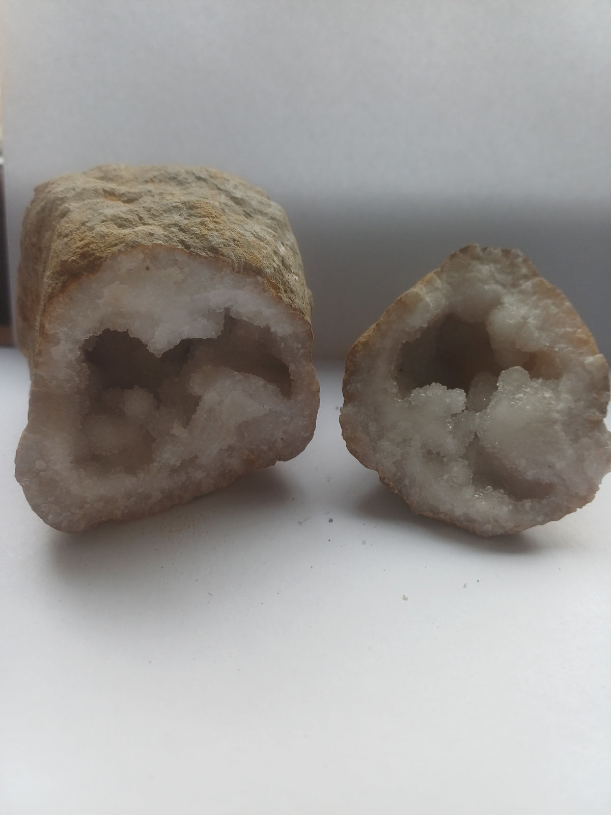 One-of-a-kind split white quartz geode pair with sparkling druzy interior